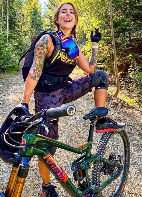 Smiling Mountain Bike Girl On Trail