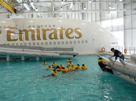 People Are In The Water With Rafts Near An Airplane That Is Painted