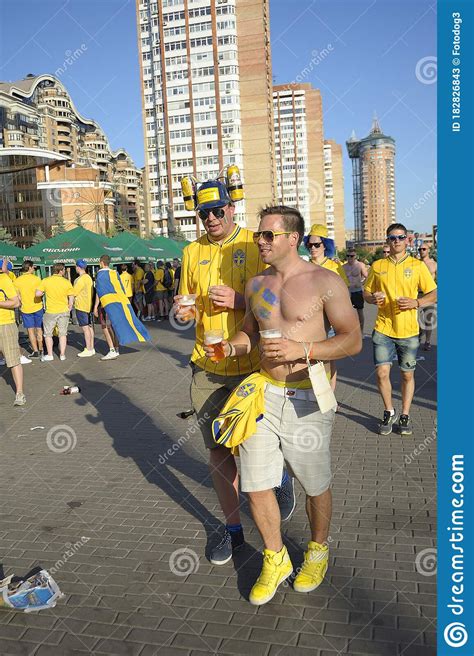 Swedish Soccer Fans Standing And Lying On A Ground With Glasses Of Beer In Hands Editorial Stock