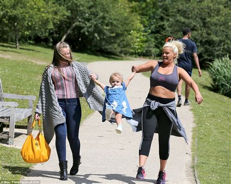 Kerry Katona Pinches Her Belly At The Park In Sports Bra And Leggings With Her Daughters Daily
