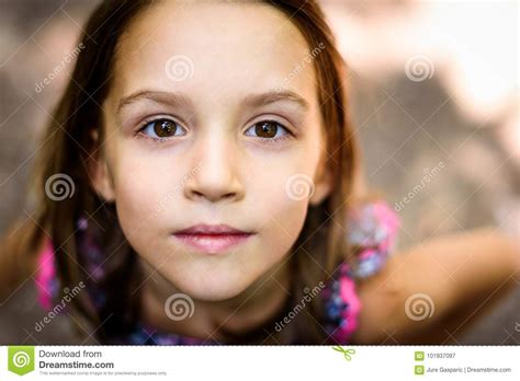 Portrait Of Little Girl Looking Up At The Parent Outdoors Stock Image