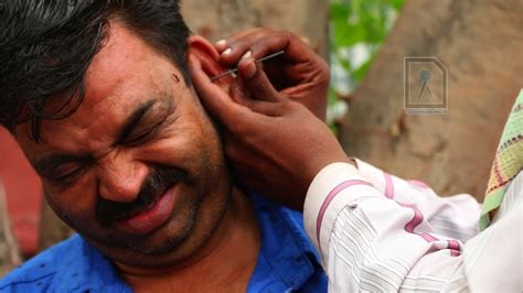 Playing it by ear means you have no game plan. Ear Waxing - Traditional ear cleaner in India - YouTube