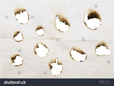 Burnt Holes In A Paper Isolated On A White Stock Photo 14391292