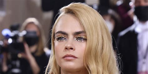 Cara Delevingne Attended The Met Gala Topless And Painted In Gold