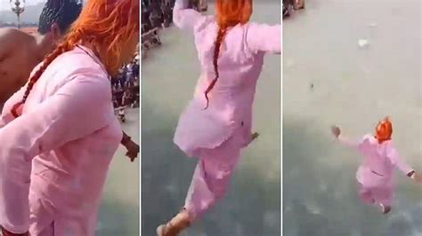 viral video 70 year old woman s risky stunt in ganga river will make your heart stop watch