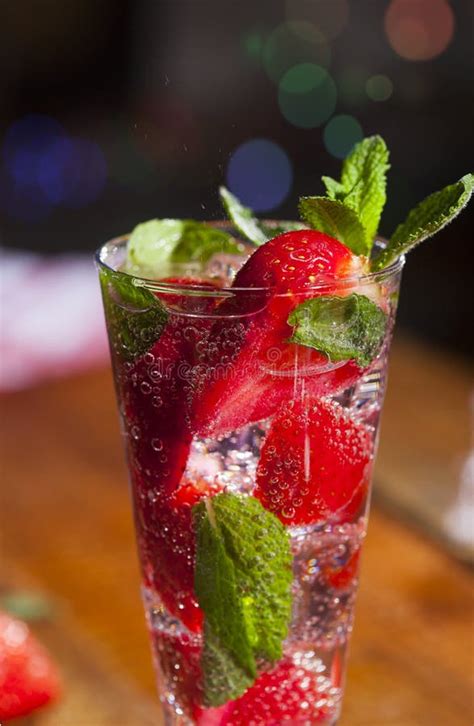 Summer Cold Drink With Strawberries Mint And Ice On Wooden Bar Counter
