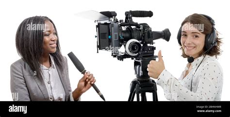 Two Beautiful Reporter Women With A Camera And Microphone Stock Photo