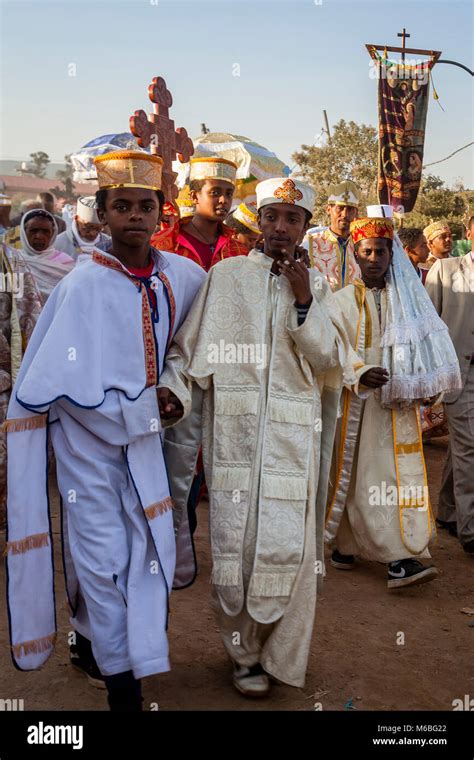 A Procession Of Ethiopian Orthodox Priests And Deacons Arrive At The