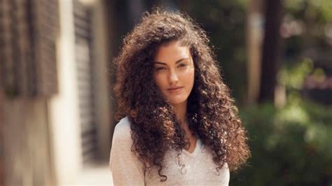 On the hunt for flattering hairstyles for thick hair? Tutorial: How To Style Long Curly Hair
