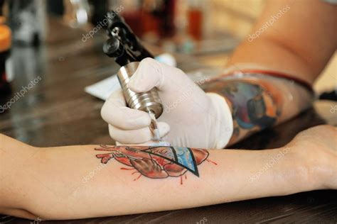 Tattoo Artist At Work Close Up Stock Photo By ©belchonock 73815679