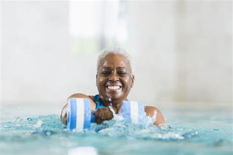 Senior Black Woman Exercising Doing Water Aerobics Advance Medical