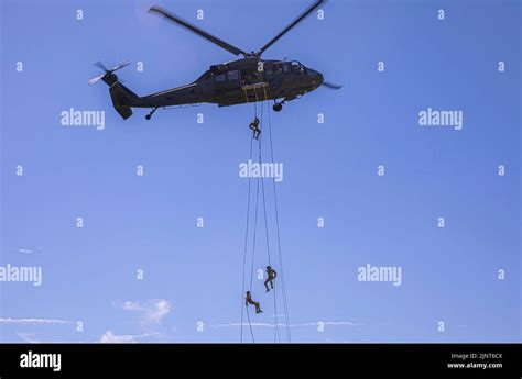 Three Soldiers Rappel From A Uh 60 Black Hawk Helicopter On August 11