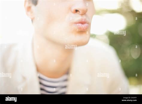 Young Man Blowing A Kiss Stock Photo Alamy