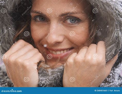 loving the first snowfall an attractive woman enjoying herself outside in the snow stock image