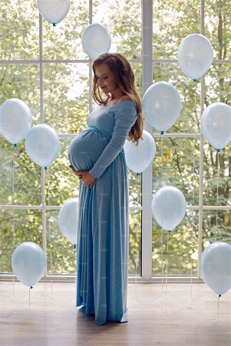 Beautiful Young Pregnant Girl In Blu Containing Pregnant Belly And