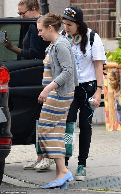 Lena Dunham Accentuates Her Fake Baby Bump In Stripes As She Cradles Stomach On New York Set Of