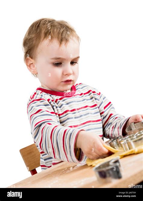 Young Child Isolated In White Background Baking Cookies Stock Photo Alamy