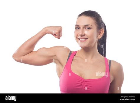 Young Beautiful Strong Woman Shows Biceps And Smiles Isolated White