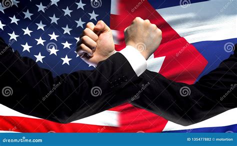 Us Vs Cuba Confrontation Countries Disagreement Fists On Flag