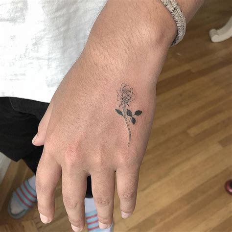 Fine Line Rose Tattoo On The Left Hand Tattoos Rose