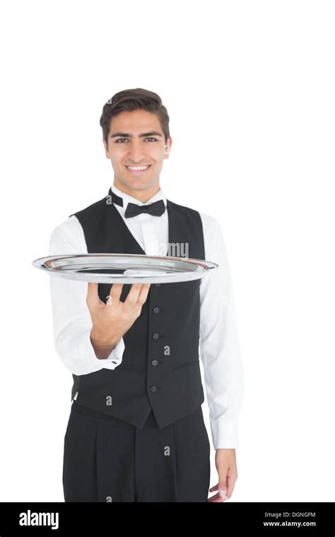 Young Waiter Presenting An Empty Tray Stock Photo Alamy