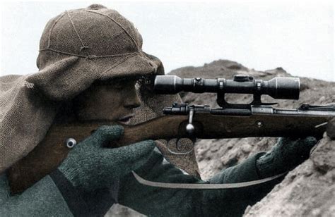 A German Sniper In Camouflage With Aon Scoped Mauser 98k Rifle On The
