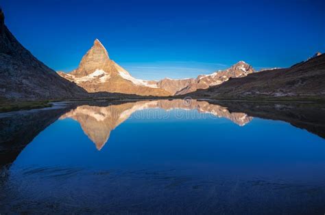 Reflection Of The Matterhorn On Blue Lake At Sunrise Swiss Alps