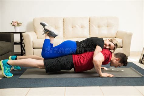 Cute Girl Helping Boyfriend Exercise Stock Image Image Of Handsome