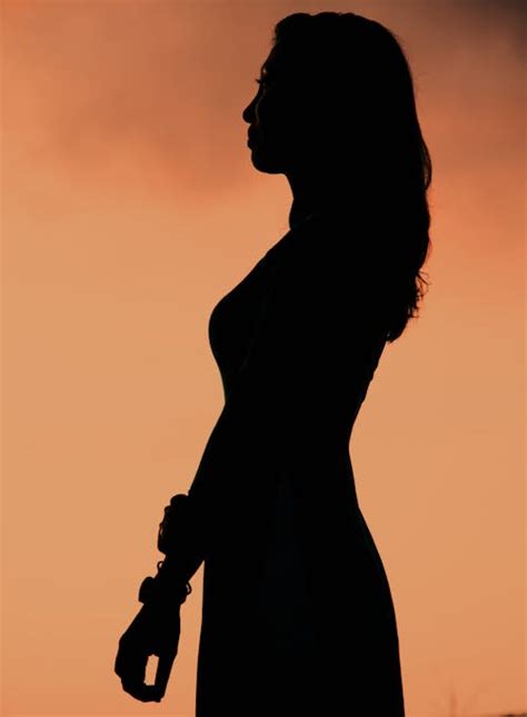 Fajarv Silhouette Of A Girl Standing Looking Up