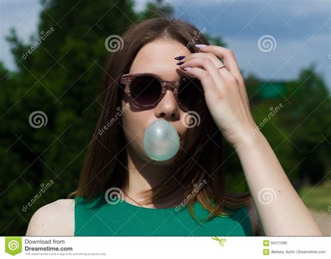 Young Pretty Girl Chews A Gum Stock Photo Image Of Indoors Arms