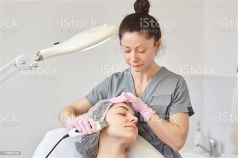 Girl Has Facial Treatment Beautiful Woman Receiving Ultrasound