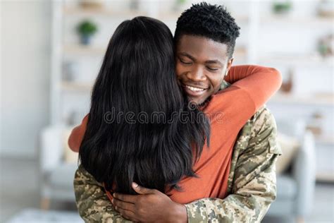 Homecoming Concept Happy Black Soldier Man Embracing Wife After