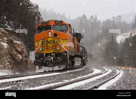 Bnsf Freight Train Steams Through A Snow Storm In The Colorado Rockies
