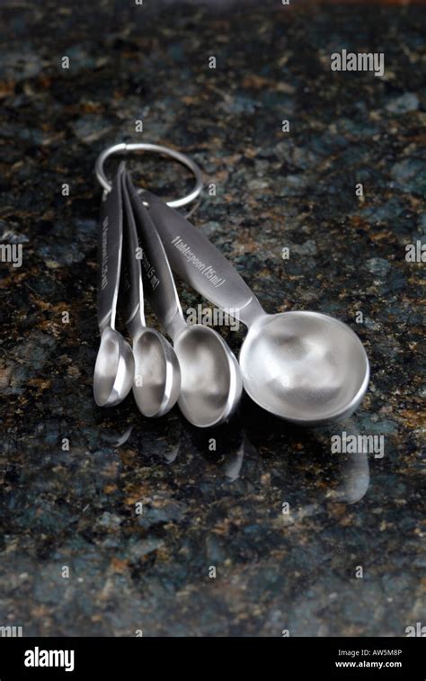 Measuring Spoons On A Granite Surface Stock Photo Alamy