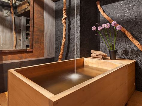 A cedar sunoko or removable slatted wooden floor surrounds the tub. Bathroom with Japanese wooden soaking tub