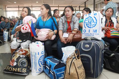 overseas filipino workers return home from syria international organization for migration