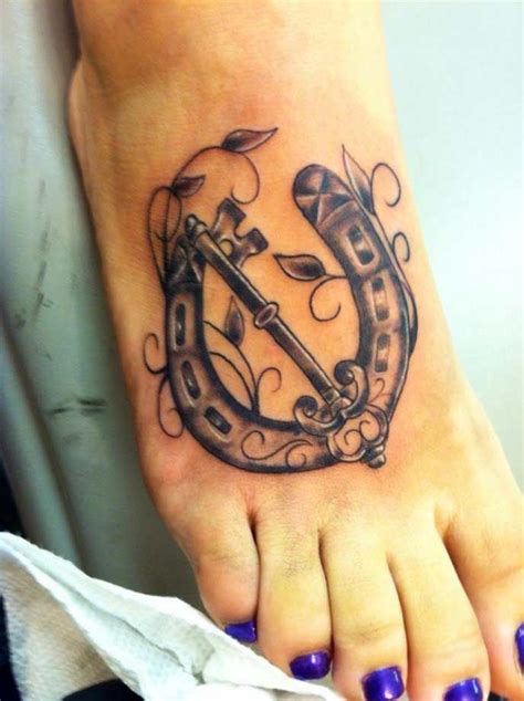 Elegant Horse Shoe Tattoo With An Key Foot Tattoos Horse Shoe Tattoo