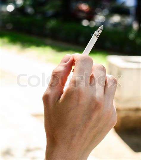 Woman Hand Holding A Cigarette Stock Photo Colourbox