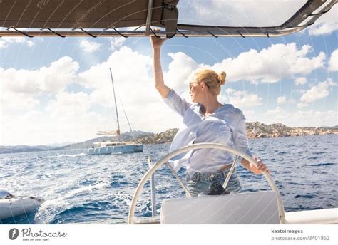 Young Woman Relaxing On The Yacht On Sea At Sunny Day A Royalty Free