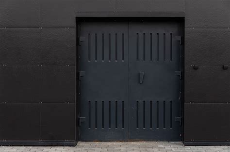 Premium Photo Industrial Door In The Building Black Steel Metal