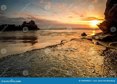 Dramatic Seascape Sunset With Orange Skies And Reflections Stock Image