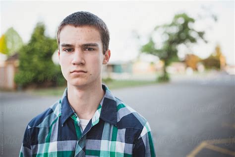 Teenage Boy Being Serious Outside Portrait By Stocksy Contributor