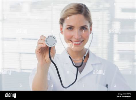 Pretty Nurse Showing Her Stethoscope Stock Photo Alamy
