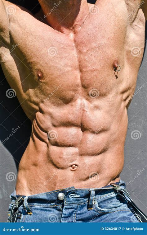 Bodybuilder Torso With Arms Up Ripped Abs And Pecs With Nipple Piercing Royalty Free Stock