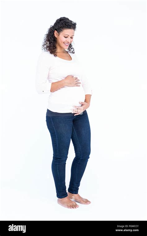 Happy Pregnant Woman Holding Abdomen Stock Photo Alamy