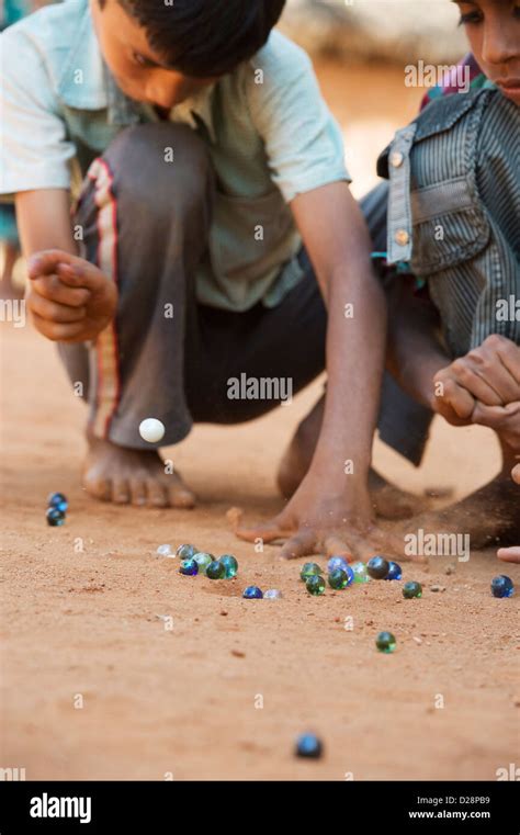 Indian Boys Playing Marbles In A Rural Indian Village Andhra Pradesh