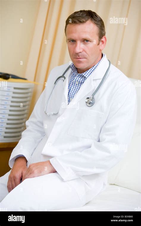 A Doctor Sitting On A Hospital Bed Stock Photo Alamy