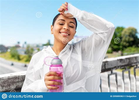 African American Woman Drinking Water From Bottle Stock Image Image