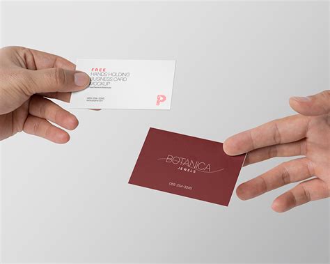 hands holding business card mockup pixpine