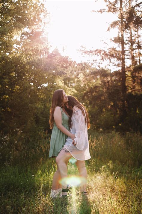 Lesbian Couple Romancing In Forest During Summer Photograph By Cavan Images Fine Art America